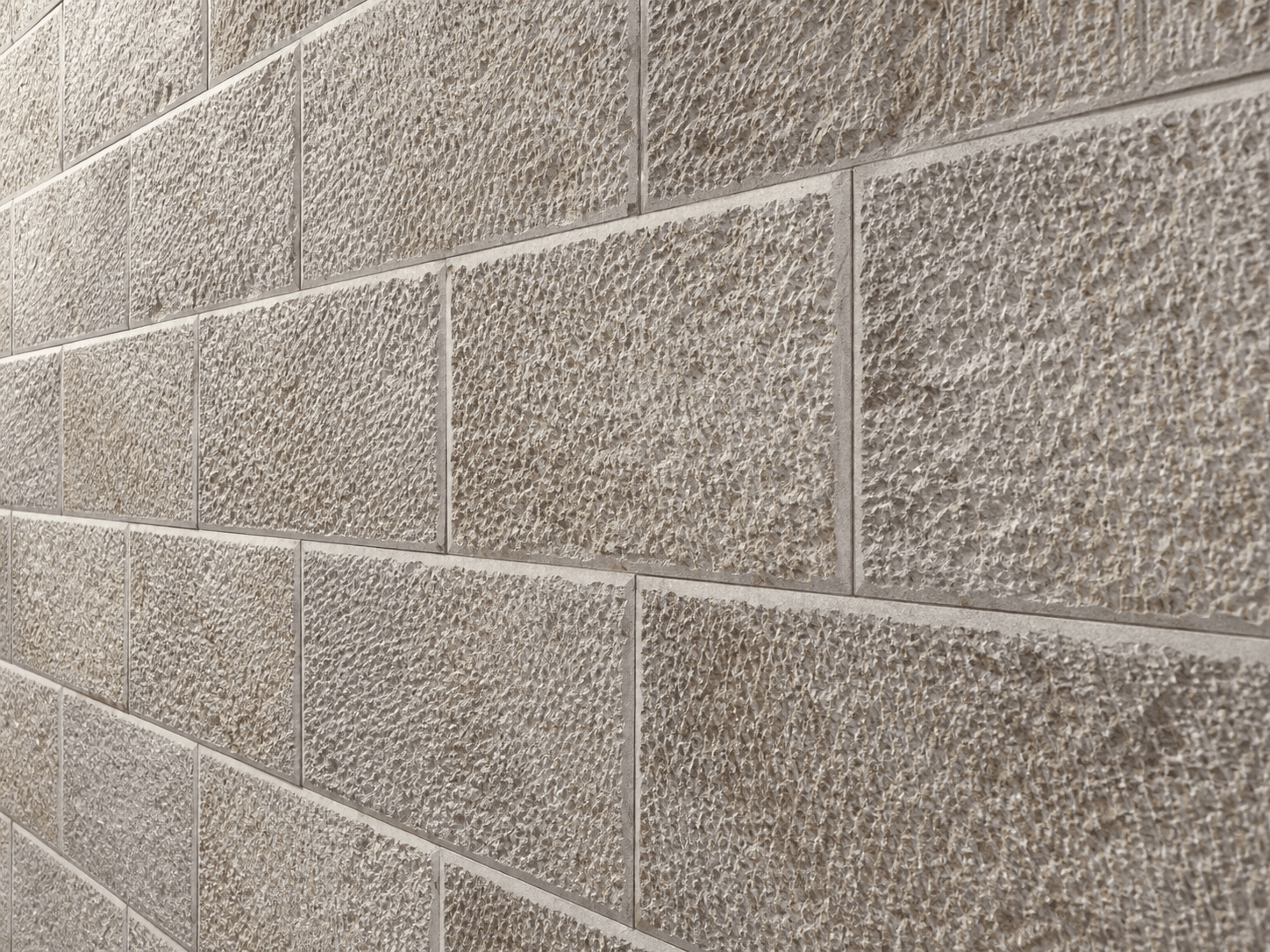 Oblique view of textured limestone walling